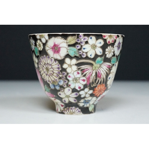 5 - Pair of 19th Century hand enamelled Chinese tea bowls, decorated with florals on a black ground. Bot... 