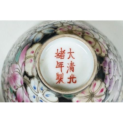 5 - Pair of 19th Century hand enamelled Chinese tea bowls, decorated with florals on a black ground. Bot... 