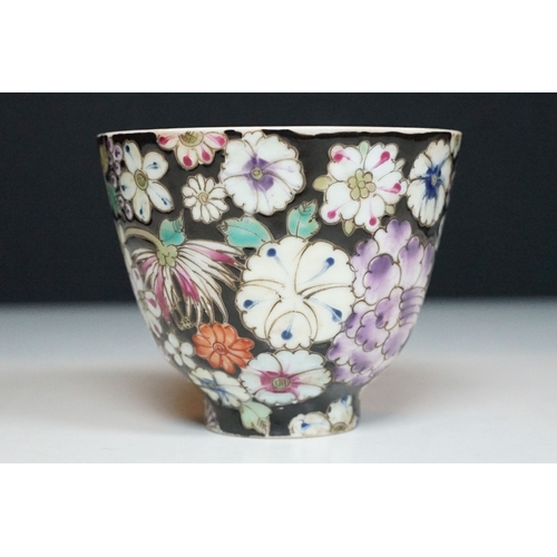 5 - Pair of 19th Century hand enamelled Chinese tea bowls, decorated with florals on a black ground. Bot... 