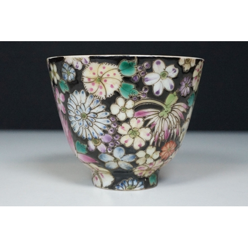 5 - Pair of 19th Century hand enamelled Chinese tea bowls, decorated with florals on a black ground. Bot... 