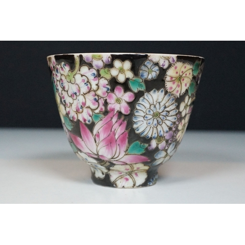 5 - Pair of 19th Century hand enamelled Chinese tea bowls, decorated with florals on a black ground. Bot... 