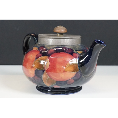 53 - Moorcroft pomegranate pattern teapot with hammered pewter hinged lid, H 12cm