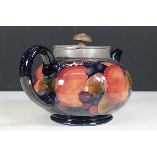 53 - Moorcroft pomegranate pattern teapot with hammered pewter hinged lid, H 12cm