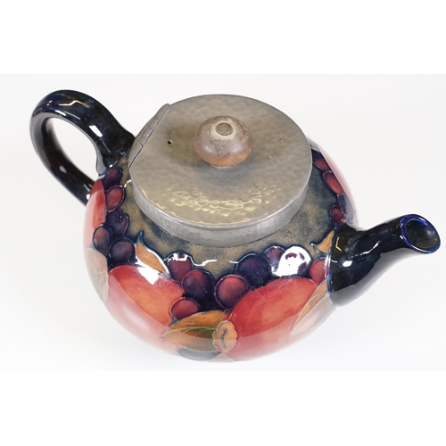 53 - Moorcroft pomegranate pattern teapot with hammered pewter hinged lid, H 12cm