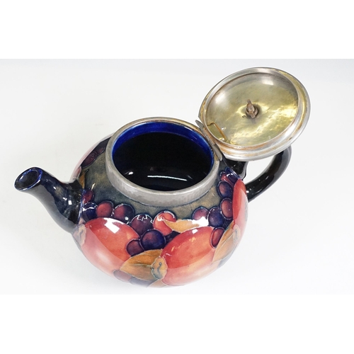 53 - Moorcroft pomegranate pattern teapot with hammered pewter hinged lid, H 12cm