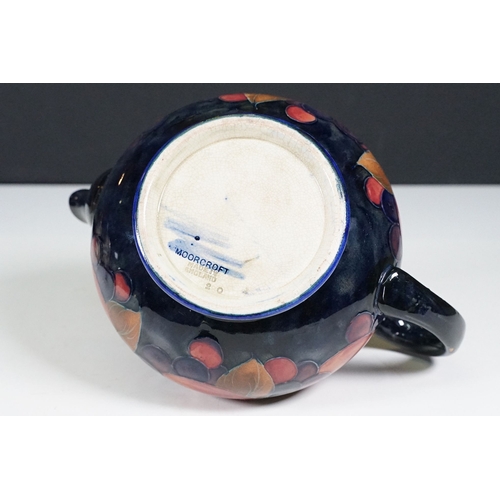 53 - Moorcroft pomegranate pattern teapot with hammered pewter hinged lid, H 12cm