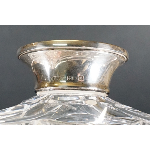 59 - Cut glass ships decanter together with a rectangular cut example both with silver collars, R&D and I... 