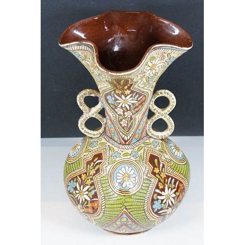 7 - Majolica twin handled vase with pinched rim, signed to base, H 32.5cm