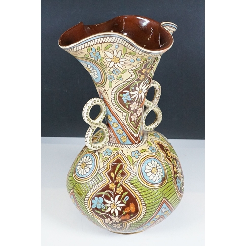 7 - Majolica twin handled vase with pinched rim, signed to base, H 32.5cm