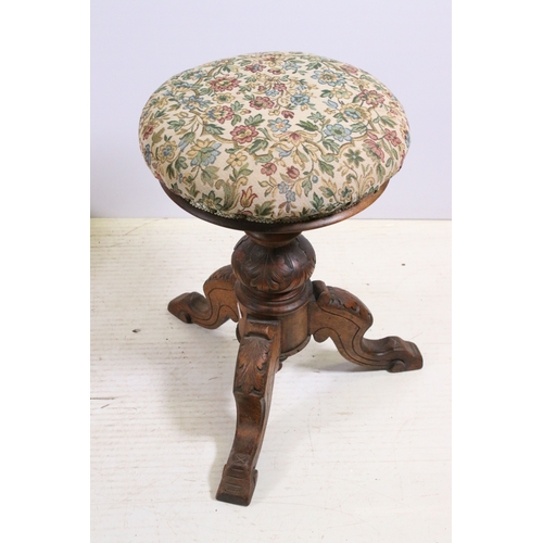 713 - Carved oak adjustable musical stool with upholstered covering H 52cm together with a small upholster... 