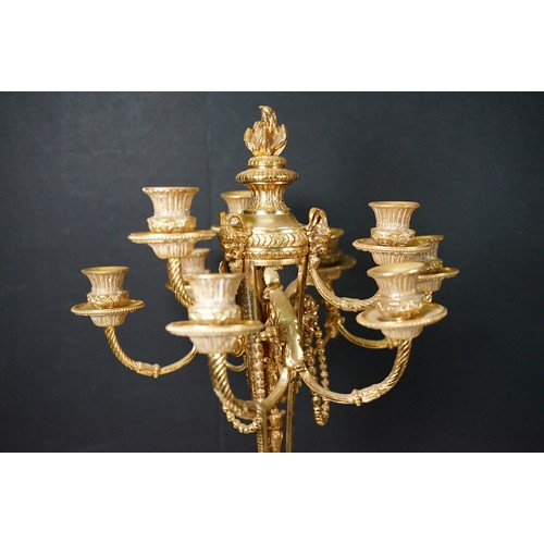 183 - Pair of large golden finish nine branch candelabras with winged cherub, beads, rams head and flame d... 