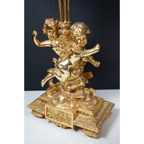 183 - Pair of large golden finish nine branch candelabras with winged cherub, beads, rams head and flame d... 