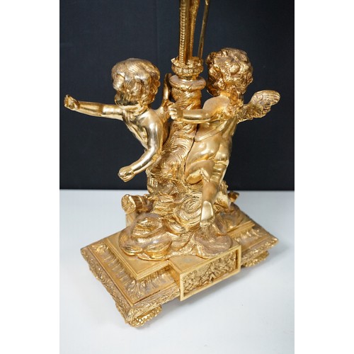 183 - Pair of large golden finish nine branch candelabras with winged cherub, beads, rams head and flame d... 