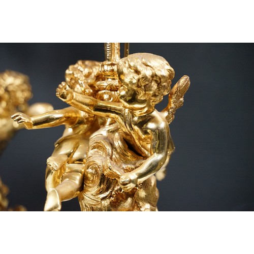 183 - Pair of large golden finish nine branch candelabras with winged cherub, beads, rams head and flame d... 