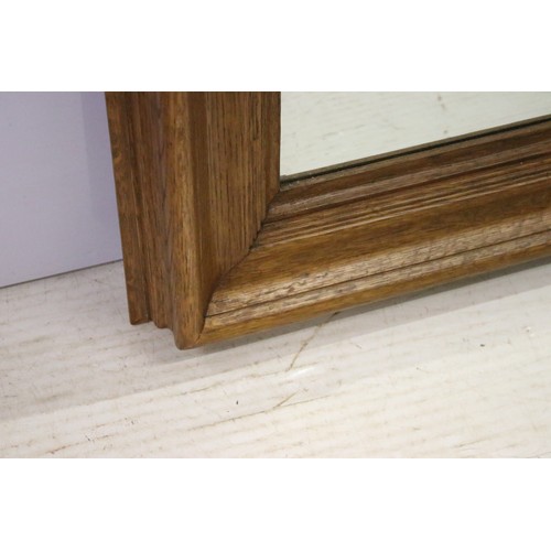 654 - 20th century oak framed rectangular mirror with bevelled glass, H 100cm, W 75cm, D 8cm