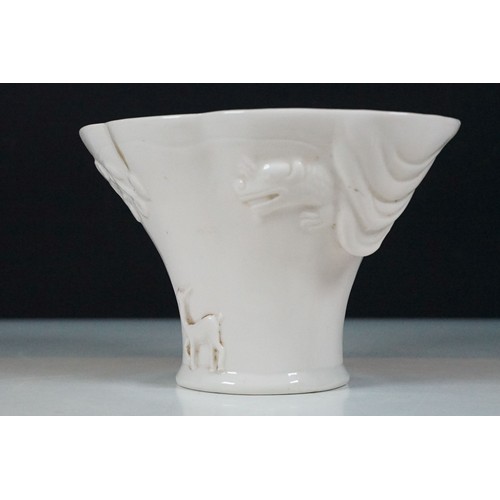 19 - Chinese Kangxi blanc de chine vase having a scalloped rim, with moulded deer, dragon and prunus deta... 