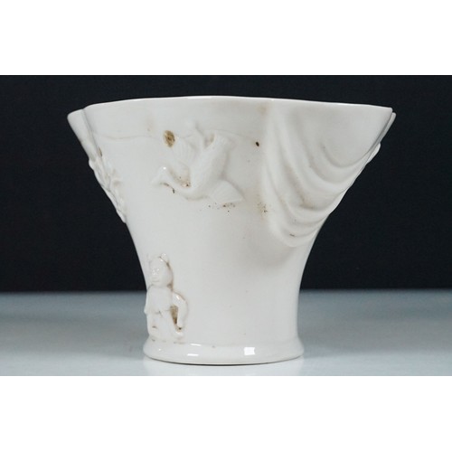 19 - Chinese Kangxi blanc de chine vase having a scalloped rim, with moulded deer, dragon and prunus deta... 