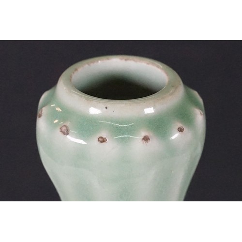 75 - Two Chinese celadon glaze vases to include a twin handles vase with dragon panel to front, together ... 