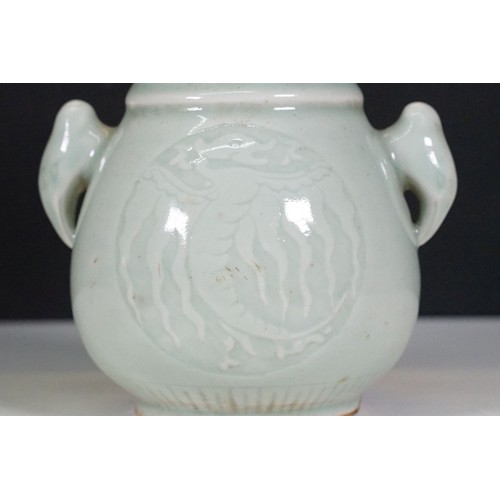 75 - Two Chinese celadon glaze vases to include a twin handles vase with dragon panel to front, together ... 