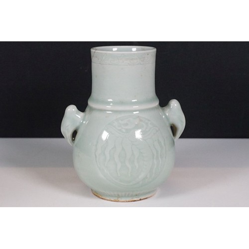 75 - Two Chinese celadon glaze vases to include a twin handles vase with dragon panel to front, together ... 