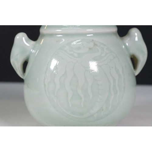 75 - Two Chinese celadon glaze vases to include a twin handles vase with dragon panel to front, together ... 