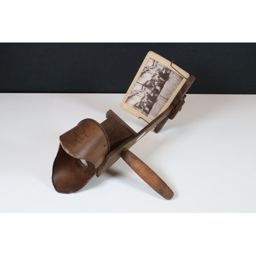 416 - Victorian wooden stereoscope with a selection of black and white cards including 'fathers coming' , ... 