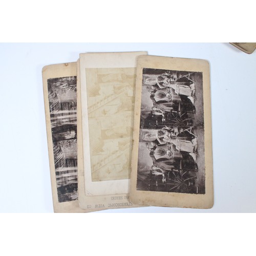 416 - Victorian wooden stereoscope with a selection of black and white cards including 'fathers coming' , ... 