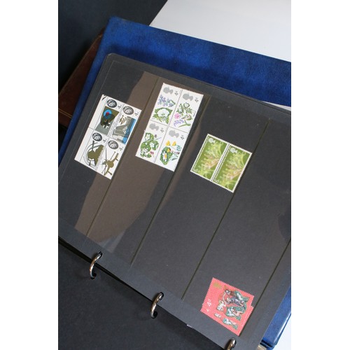 423 - Collection of Great British stamps to include two Stanley Gibbons albums housing mostly unused Queen... 