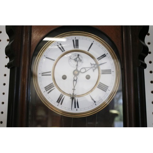 638 - Pair of early 20th century two train wall clocks, the enamel dials with Roman numerals and secondary... 