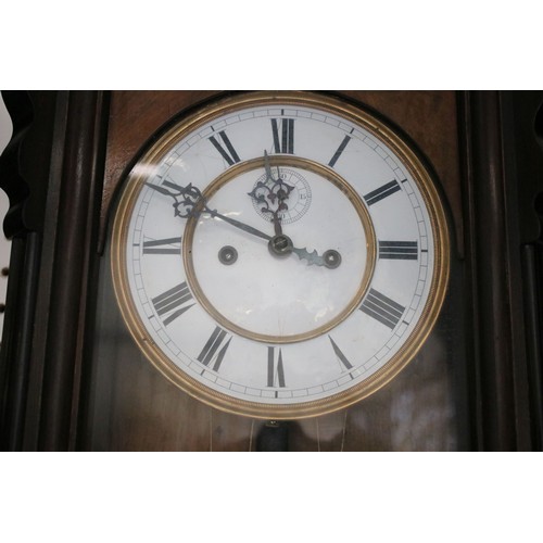 638 - Pair of early 20th century two train wall clocks, the enamel dials with Roman numerals and secondary... 