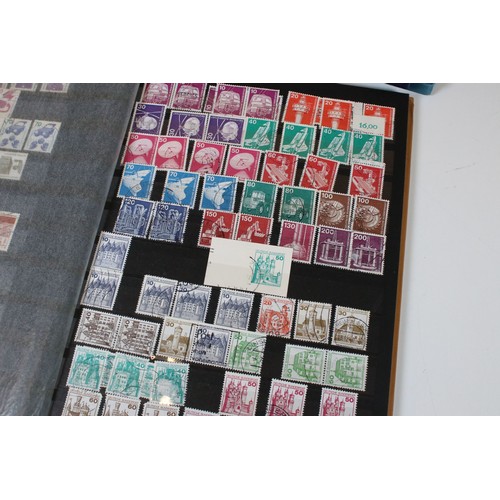 428 - Collection of mostly German stamps to include two albums of Great British QEII used stamps, an album... 