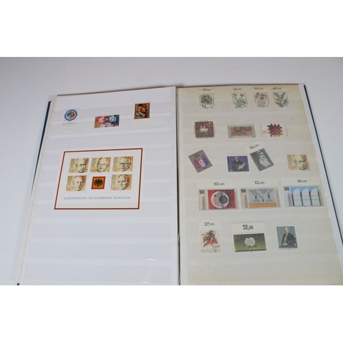 428 - Collection of mostly German stamps to include two albums of Great British QEII used stamps, an album... 