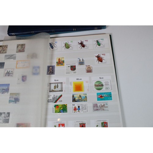 428 - Collection of mostly German stamps to include two albums of Great British QEII used stamps, an album... 