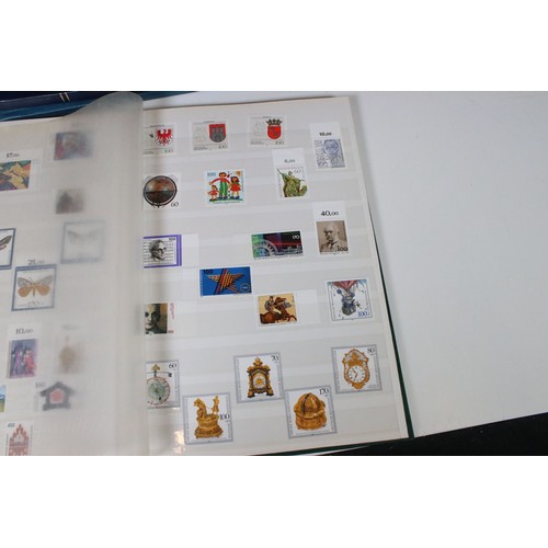 428 - Collection of mostly German stamps to include two albums of Great British QEII used stamps, an album... 