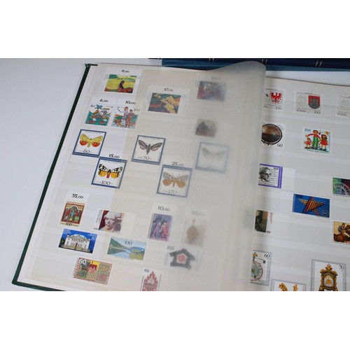 428 - Collection of mostly German stamps to include two albums of Great British QEII used stamps, an album... 