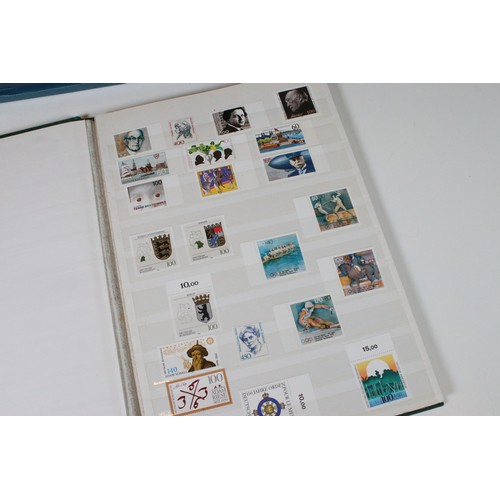 428 - Collection of mostly German stamps to include two albums of Great British QEII used stamps, an album... 