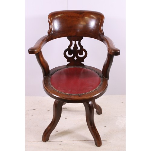 665 - Mahogany swivel office desk chair with central pierced back splat and curved back bar, H 91cm