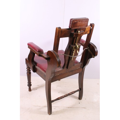 667 - Early 20th century patent barbers chair with stud detail, adjustable head rest and reclining back, n... 