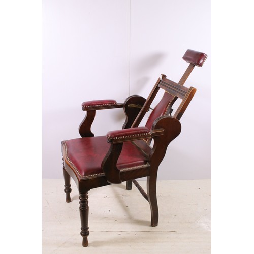 667 - Early 20th century patent barbers chair with stud detail, adjustable head rest and reclining back, n... 