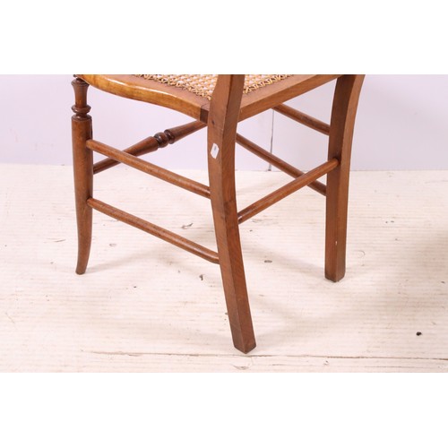 670 - Pair of early 20th century cane seat chairs with carved detail to back rest, H 83cm