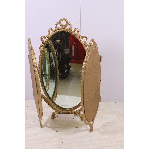 671 - Gilt oval triptych dressing mirror with ribbon decoration, H 70cm