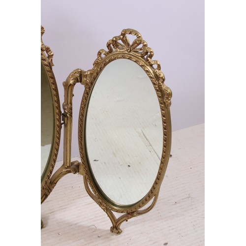 671 - Gilt oval triptych dressing mirror with ribbon decoration, H 70cm