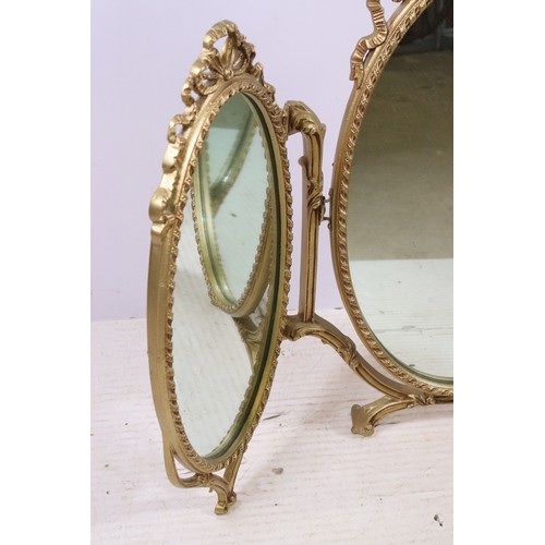 671 - Gilt oval triptych dressing mirror with ribbon decoration, H 70cm