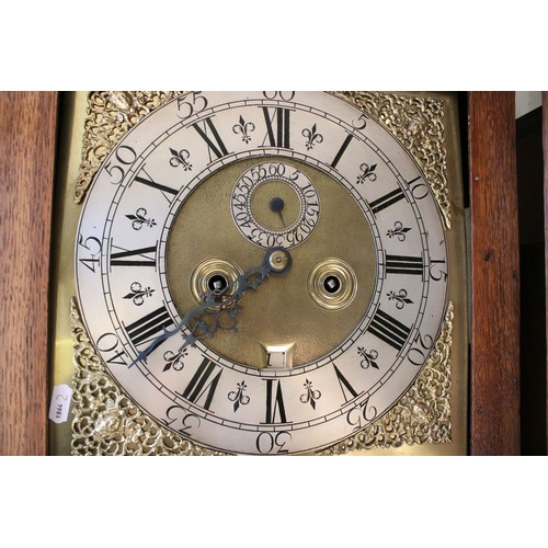 721 - 19th century mahogany two train longcase clock, the stepped hood with brass finials, the silvered di... 