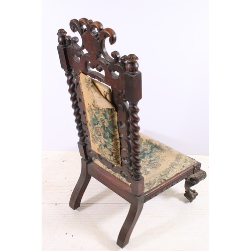 725 - 19th century continental mahogany ornately carved chair of low proportions on carved cabriole legs w... 