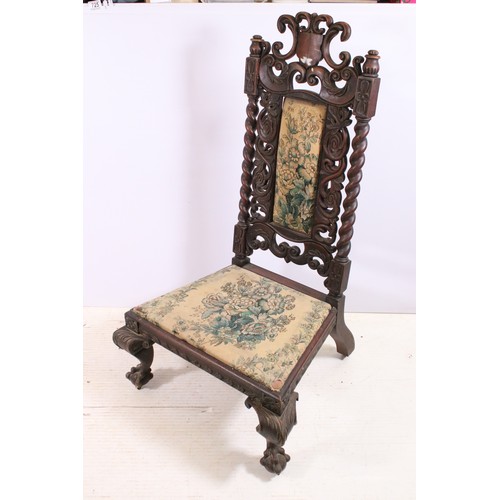 725 - 19th century continental mahogany ornately carved chair of low proportions on carved cabriole legs w... 