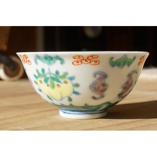 2 - Pair of 19th Century Chinese tea bowls to include a footed cup decorated with florals with a six cha... 