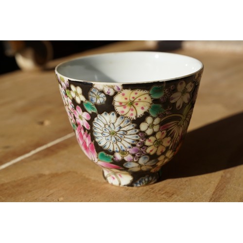 5 - Pair of 19th Century hand enamelled Chinese tea bowls, decorated with florals on a black ground. Bot... 