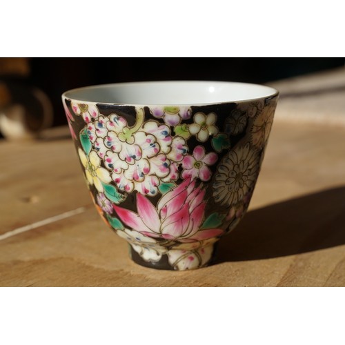 5 - Pair of 19th Century hand enamelled Chinese tea bowls, decorated with florals on a black ground. Bot... 