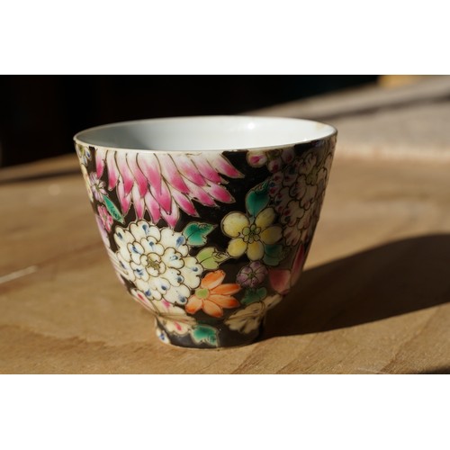 5 - Pair of 19th Century hand enamelled Chinese tea bowls, decorated with florals on a black ground. Bot... 